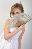 beautiful girl hiding behind a fan