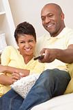 African American Couple Eating Popcorn Watching Television
