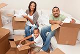 African American Family Unpacking Boxes Moving House
