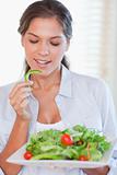 Portrait of a healthy woman eating a salad