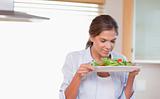 Woman smelling a salad