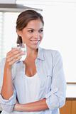 Portrait of a woman holding a glass of water
