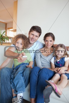 Portrait of a family watching TV together