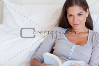 Attractive woman holding a book