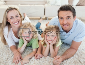 Family lying on the carpet