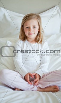 Girl sitting on the bed