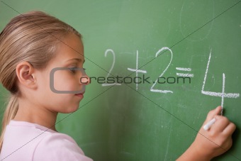 Schoolgirl writing a number