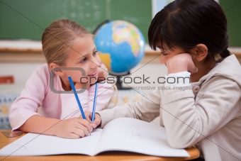 Cute schoolgirls doing classwork