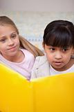 Portrait of schoolgirls reading
