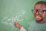 Smart schoolboy showing the mass-energy equivalence