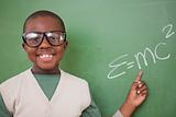 Smart schoolboy showing the the mass-energy equivalence formula