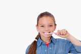Healthy girl brushing her teeth