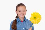 Girl holding a yellow flower