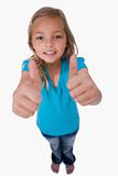 Portrait of a young girl with the thumbs up