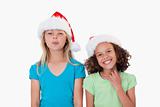 Cheerful girls with Christmas hats