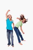 Portrait of cheerful girls jumping
