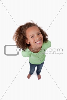 Portrait of a cute playful girl smiling at the camera