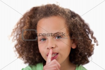Close up of a girl asking for silence