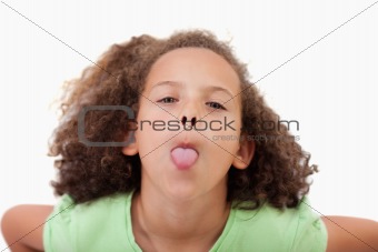 Cute girl sticking out her tongue