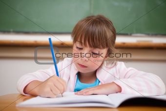 Serious girl writing