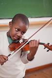 Portrait of a schoolboy playing the violin