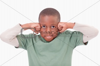 Boy with the fists on his face