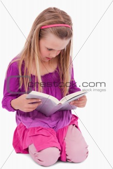 Portrait of a girl reading a book