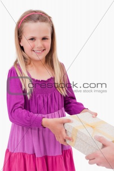 Portrait of a happy girl receiving a present