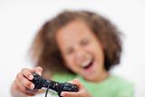 Smiling girl playing a video game
