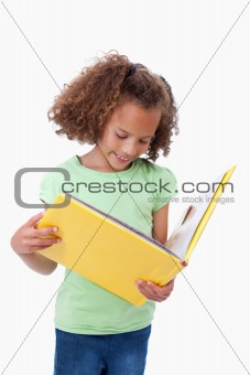 Portrait of a girl reading a fairy tale