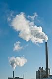 Factory with Smokestacks and Blue Sky