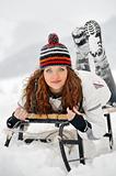 Young Beautiful Woman on sledge  in winter time