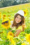 Young beautiful girl  in a sunflower field