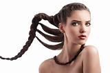 beauty shot  hairstyle portrait of beautiful brunette girl with creative braid hairdo and naked shoulder