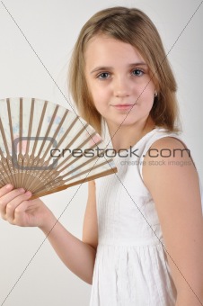 child with a fan
