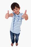 Portrait of a boy smiling at the camera with the thumbs up