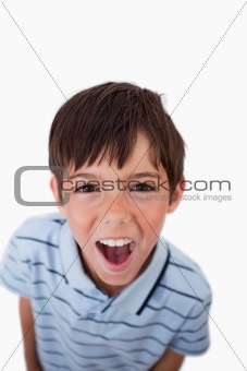 Portrait of a boy screaming at the viewer
