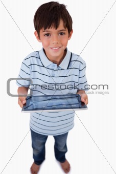 Portrait of a happy boy using a tablet computer