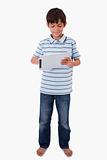 Portrait of a smiling boy using a tablet computer