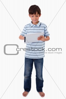 Portrait of a smiling boy using a tablet computer