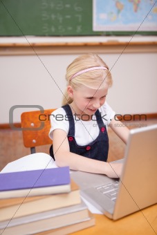 Portrait of a little girl using a laptop