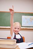 Portrait of a girl raising her hand