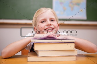 Girl leaning on books