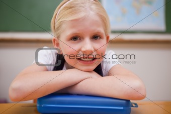 Girl leaning on her desk