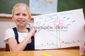 Girl showing her drawing