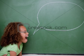 Schoolgirl posing with a speech bubble