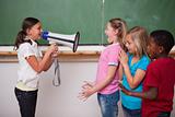 Schoolgirl screaming through a megaphone to her classmates