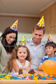 Family celebrating daughters birthday