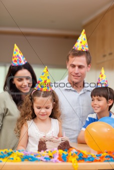 Happy family celebrating daughters birthday
