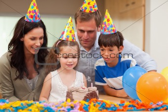 Girl blew out the candles on her birthday cake